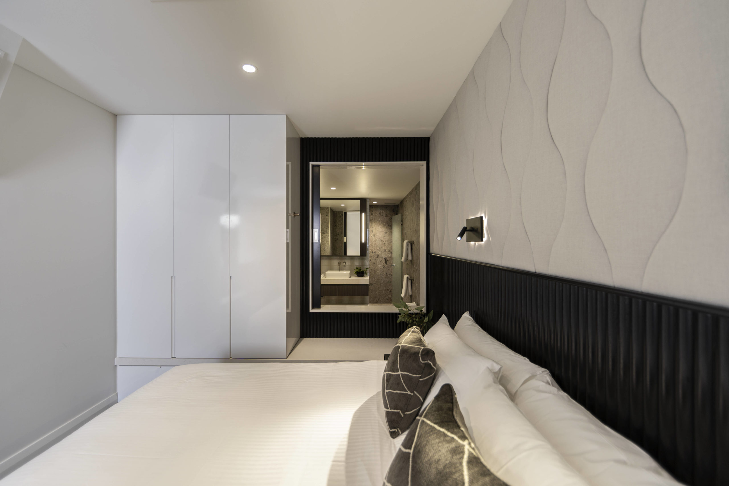 Majestic-M-Suites-One-Bedroom-Suite-Bedroom-and-Bathroom-1-scaled.jpg